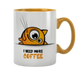 Mug with cartoon cat and 'I need more coffee' text on a white background