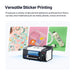 Sticker printing machine with examples of printed stickers on a white background